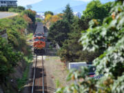 An empty coal train heads south in Bellingham.