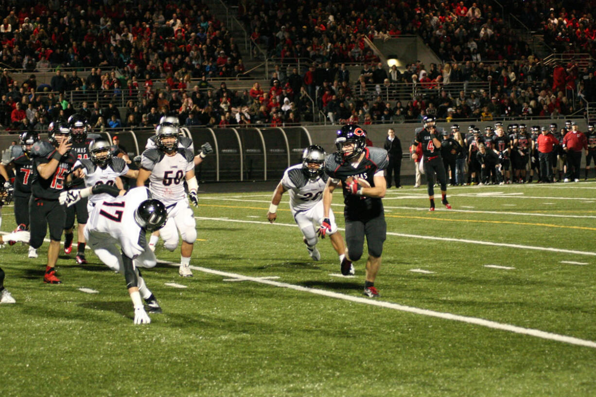 Nate Beasley sees the path the Camas offensive line created for him to get into the end zone Friday, at Doc Harris Stadium.