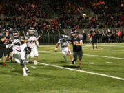 Nate Beasley sees the path the Camas offensive line created for him to get into the end zone Friday, at Doc Harris Stadium.