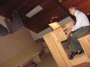 Gary Ritter plays at the new electric organ console installed as part of the existing pipe organ at St. Matthew Lutheran Church in Washougal. The community is invited to a celebration on Sunday, when Portland organist Bill Crane will perform.