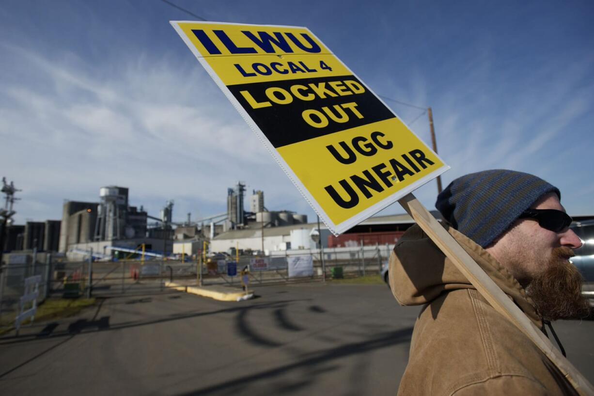 ILWU workers picket in front of the Port of Vancouver's Gate 2 on Monday.