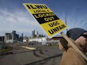 ILWU workers picket in front of the Port of Vancouver's Gate 2 on Monday.