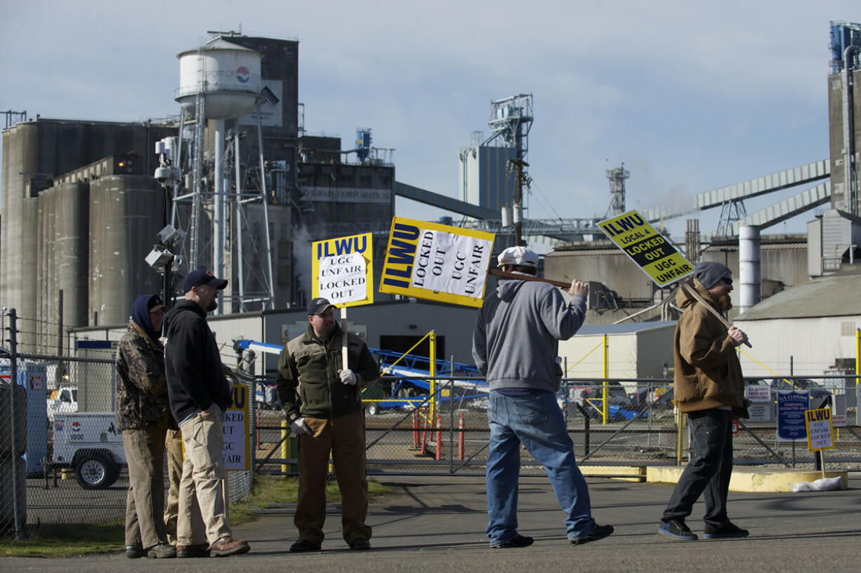 ILWU workers picket in front of the Port of Vancouver's Gate 2 on Monday.