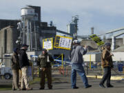 ILWU workers picket in front of the Port of Vancouver's Gate 2 on Monday.