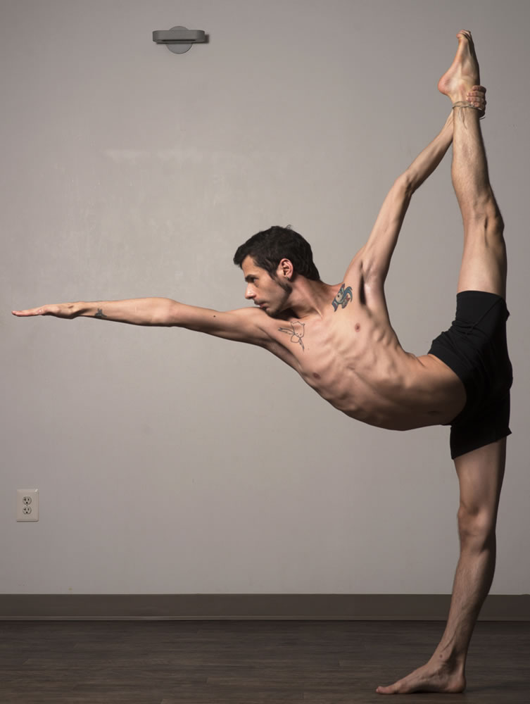 Adrian Hummell strikes a yoga pose.