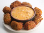 Homemade potato tots with dipping sauce.