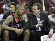 Portland Trail Blazers head coach Terry Stotts, right, talks with rookie guard Damian Lillard during halftime of an NBA preseason basketball game against the Sacramento Kings in Sacramento, Calif, Monday, Oct. 15, 2012.