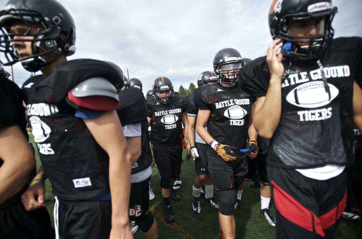 Battle Ground's defensive group leaves the field during practice on Tuesday.