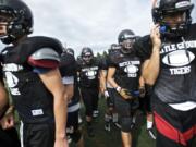 Battle Ground's defensive group leaves the field during practice on Tuesday.