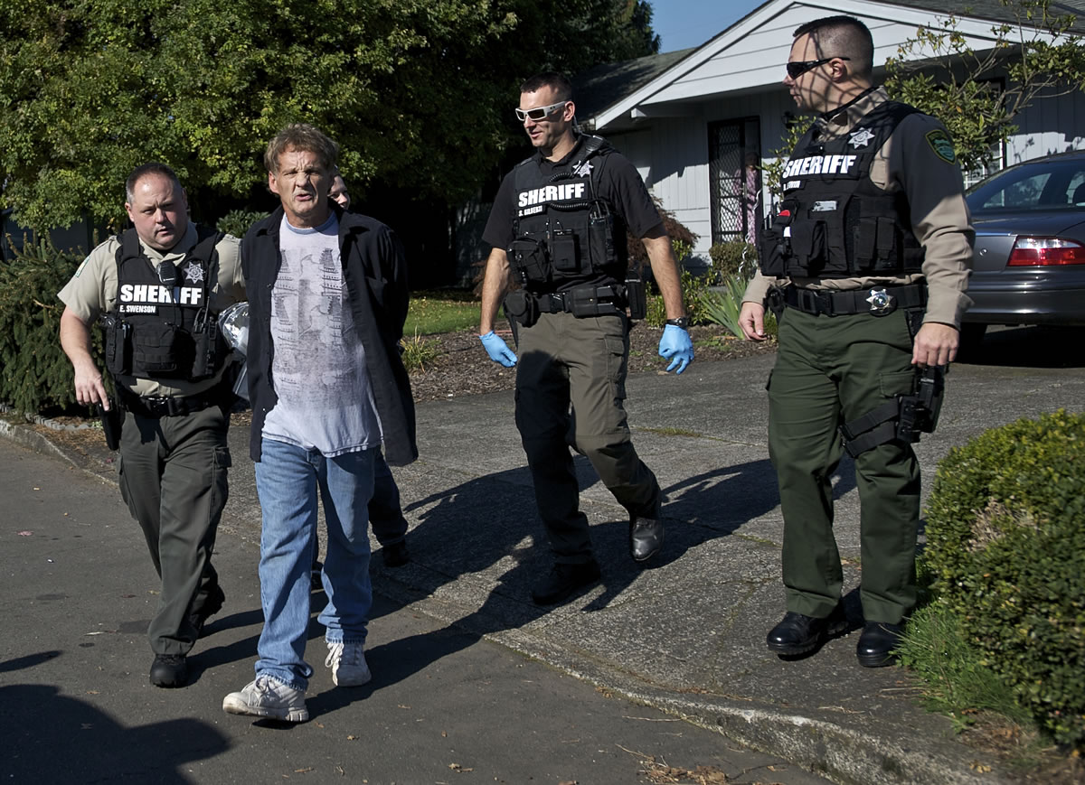 Deputies take Martin Flack, 55, into custody Wednesday for allegedly failing to make contact with his Department of Corrections probation officer, among other compliance issues.