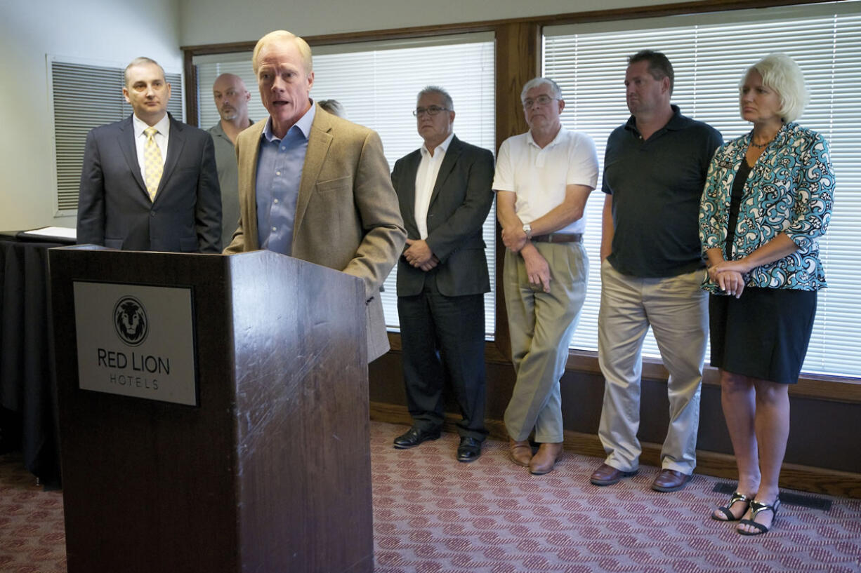 Washington State representative Paul Harris, R-Vancouver, speaks at a press conference with business and labor leaders who support terminal expansions that encourage growth in trade Thursday in Vancouver.