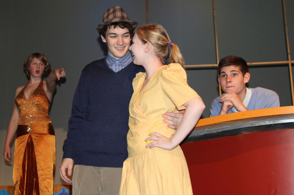 Students Sarah Russell, from left, Nick Hulscher, Ashlee Waldbauer and Josh Snider play the leading roles in &quot;Singin' in the Rain,&quot; which opens Nov.