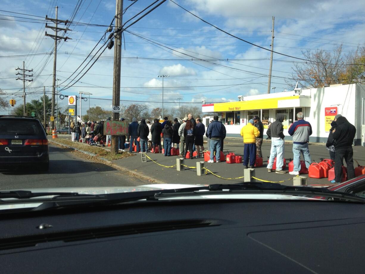 Heather Allmain/Clark Public Utilities
People stand in line for gas in New Jersey. Clark Public Utilities is in New Jersey to help restore power following Superstorm Sandy.