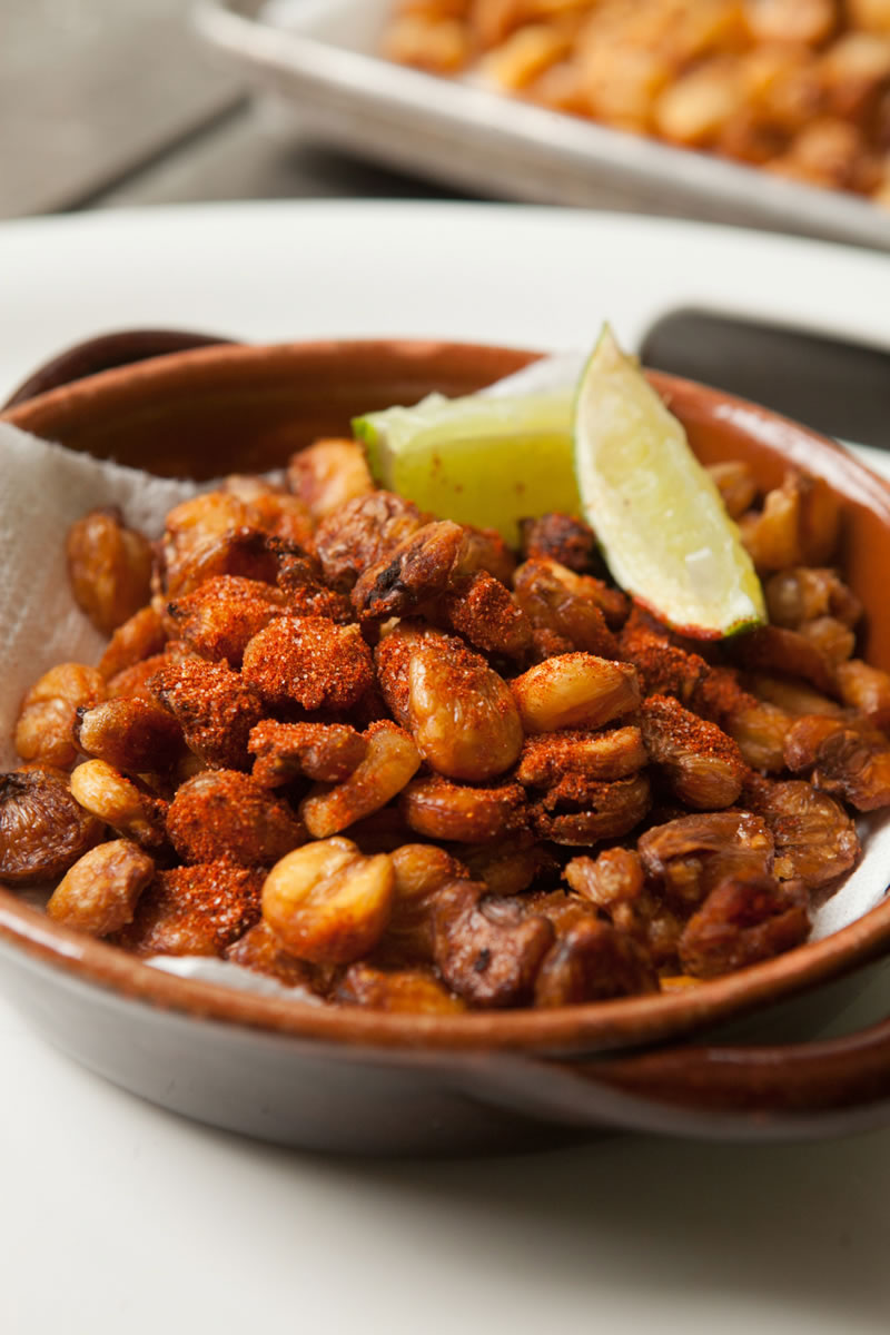 Though technically not popcorn, dried hominy is soaked, fried and sprinkled with chili spice.