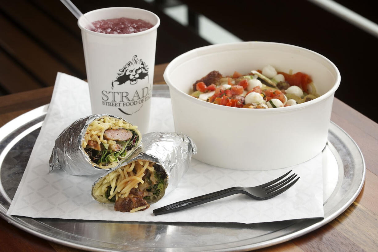 Piadina, a pasta bowl and an Italian soda served at Strada in Vancouver.