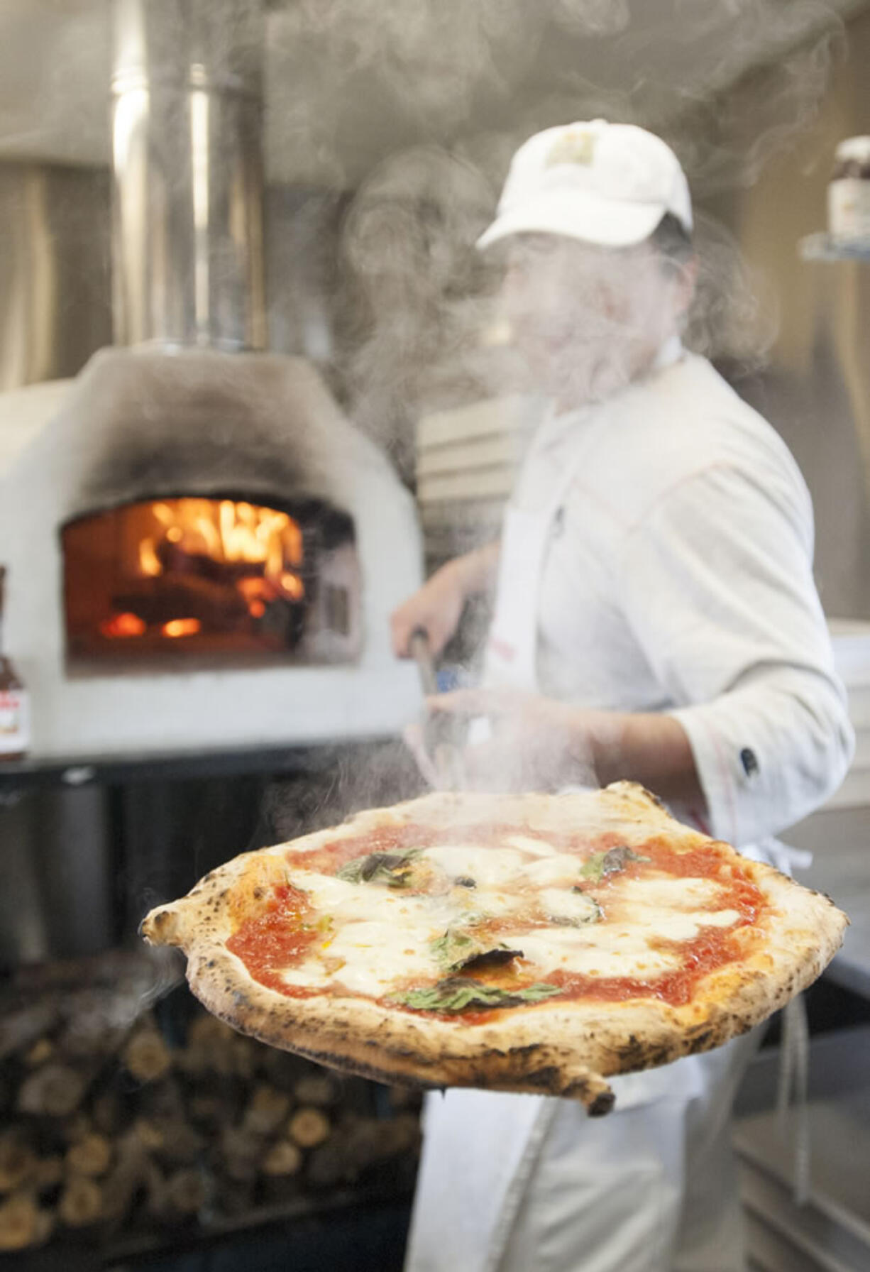 Daisuke Matsumoto got advice on how to install and use his wood fire oven by calling a food cart in Buffalo, N.Y., which also uses the oven.