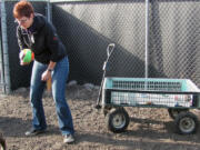 Tamara Scharfenkamp, executive director of the West Columbia Gorge Humane Society, plays ball Friday with Kira, a 4-year old female terrier mix available for adoption, in November.