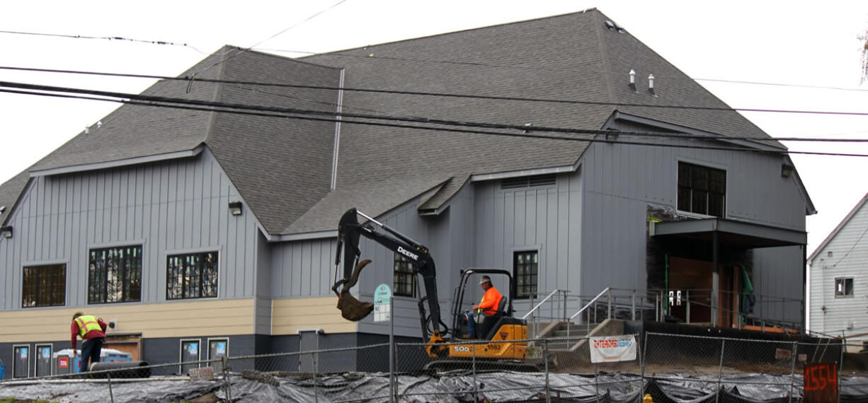 Crews work to finish up renovations on the American Legion Hall at 1554 N.E. Third Ave. On Tuesday, Nov. 20, its new occupants, CID Bio-Science, will welcome the public during an open house from 10 a.m.