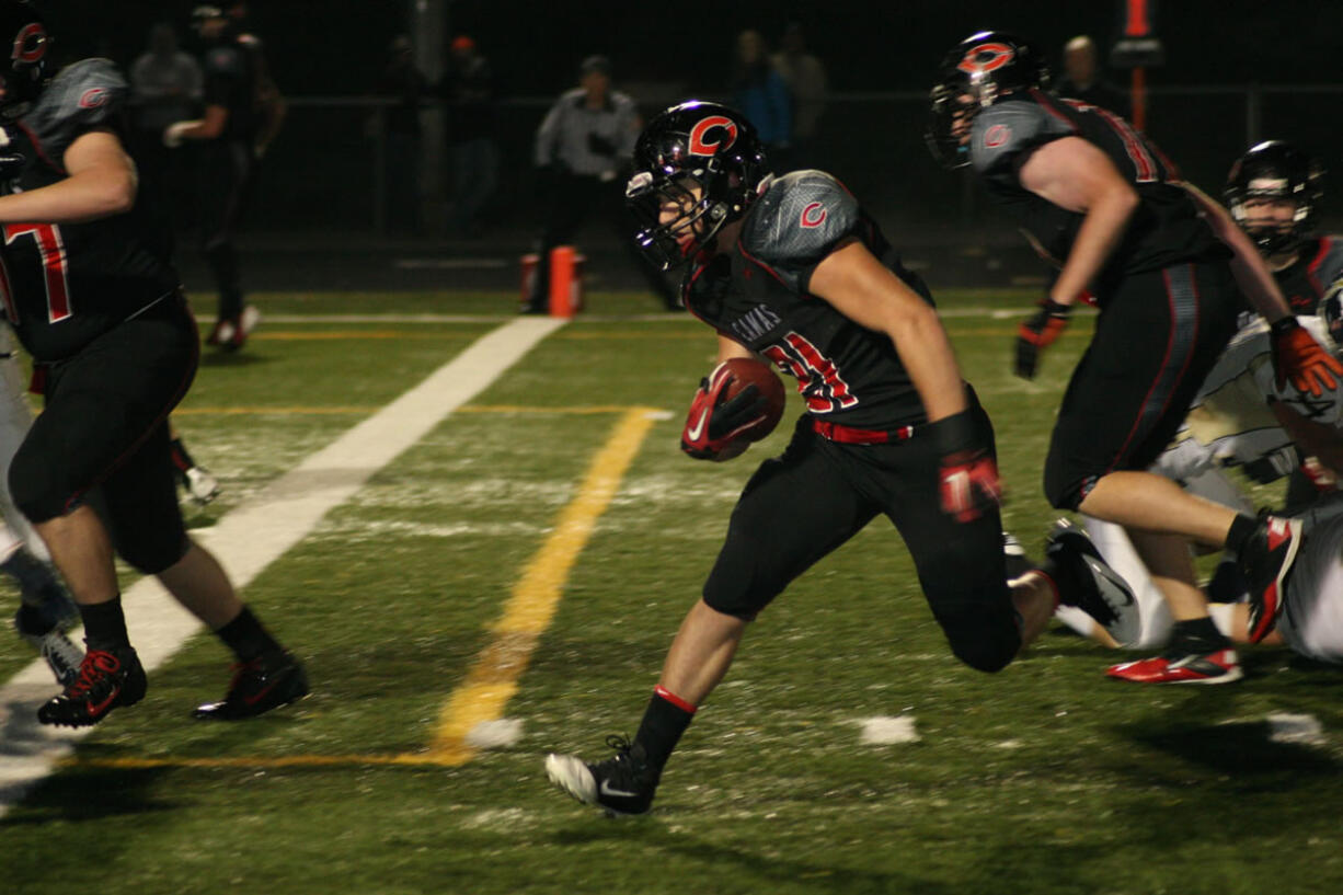 Vince Huber gallops to the end zone for one of his four touchdowns Saturday, at Doc Harris Stadium.