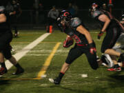 Vince Huber gallops to the end zone for one of his four touchdowns Saturday, at Doc Harris Stadium.