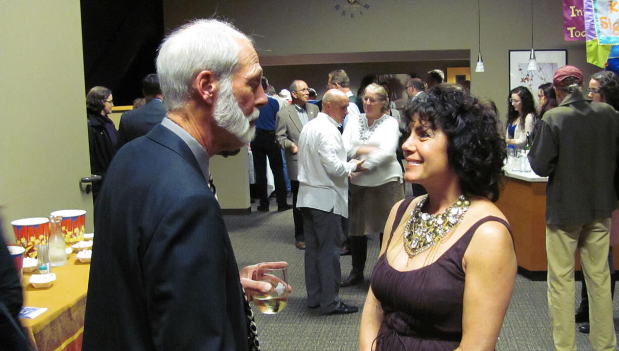 Downtown Camas business owners and local officials gathered Wednesday night at Journey Community Church, to recognize some of the individuals who have made a difference with their time and talents. Attendees included John Dietzman (left), husband of Camas City Councilwoman Linda Dietzman, and Downtown Camas Association Board President Caroline Mercury (right). Mercury received the &quot;Creative Local Marketing&quot; award, for coordinating a sale of paper mill artifacts.