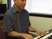 Louis Pain, of Washougal, practices on a Hammond B-3 organ in his &quot;man cave&quot; at home.