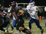 Nate Beasley cuts by three defenders and inches toward his fifth touchdown of the game Saturday, at Doc Harris Stadium.