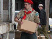 Last year, donations collected by Walk &amp; Knock volunteers were brought to the Tidland Corp., parking lot in Camas, one of 10 drop off sights throughout Clark County. There, the non-perishable food items were boxed up and loaded into a truck by volunteers including members of Boy Scout and Girl Scout troops and other service organizations. This year's Walk &amp; Knock food drive is scheduled for Saturday.