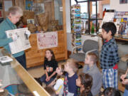 The Two Rivers Heritage Museum volunteer Carol Phillips reads the story of Princess White Wing to second-graders from Hathaway Elementary School.