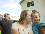 Brynley Verbeck, 4, shown with her mom, Jen Verbeck, fell out of her second-story bedroom window and was caught by attentive neighbor Nathaniel Forest, left.