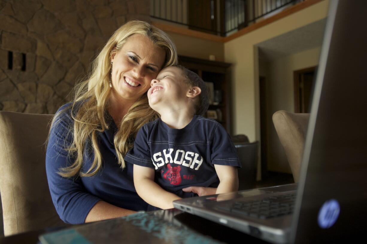 Diamond Tea organizer Angela Maitland, 35, and her 4-year-old son, Xavier, at their Brush Prairie home.