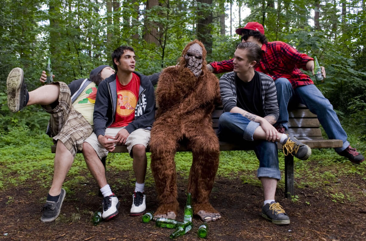 Marina French
The Sindicate -- Josh Garrett, from left, Stephen Clark, Dominic Bianchini and James Davenport -- sits with the namesake of its upcoming second album, &quot;Sasquatch.&quot; The reggae rock group will kick off its summer tour July 13 at the Brickhouse Bar and Grill.