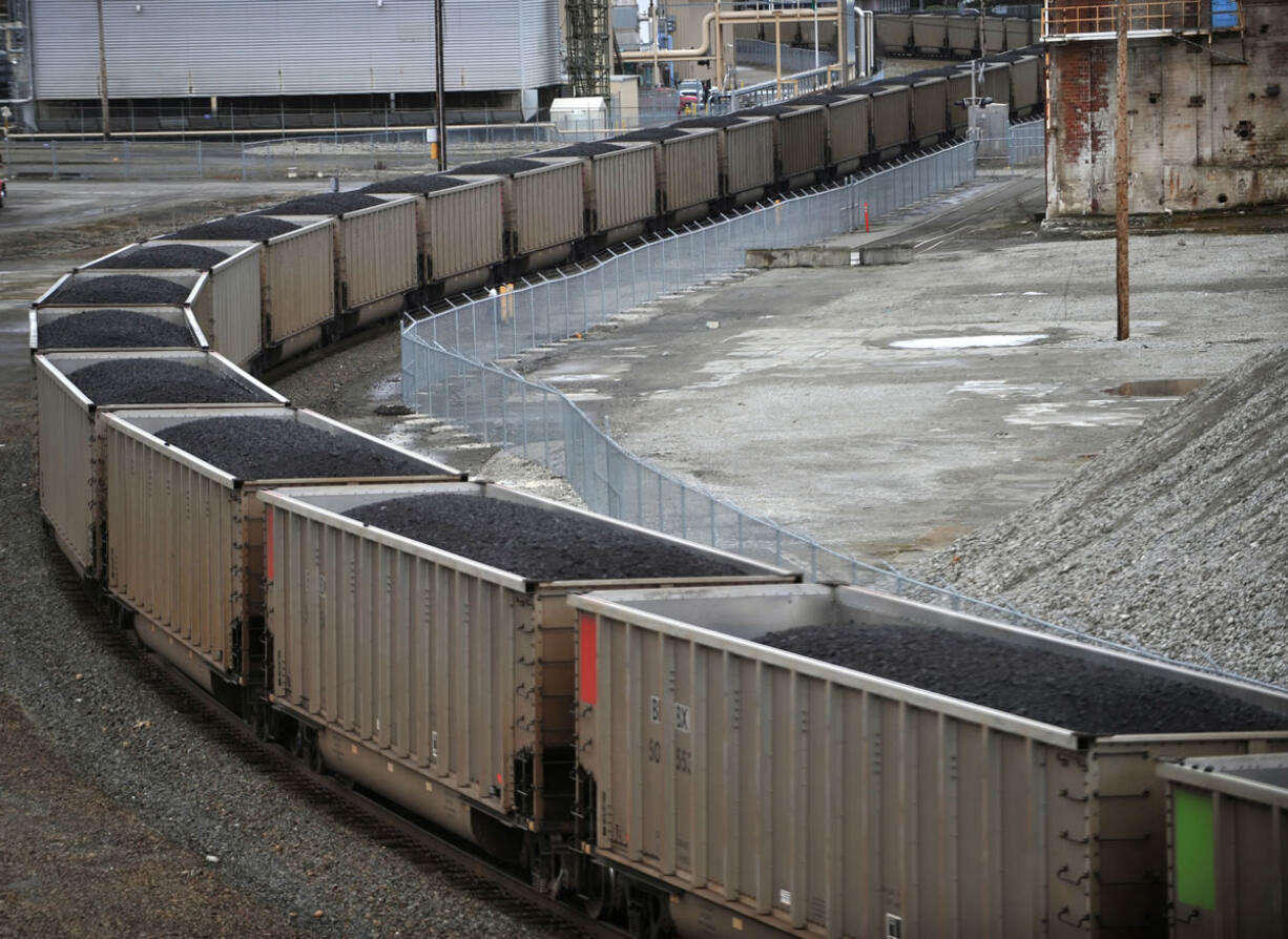 A coal train is heading north through the old Georgia-Pacific site in Bellingham, Washington, March 1, 2011.