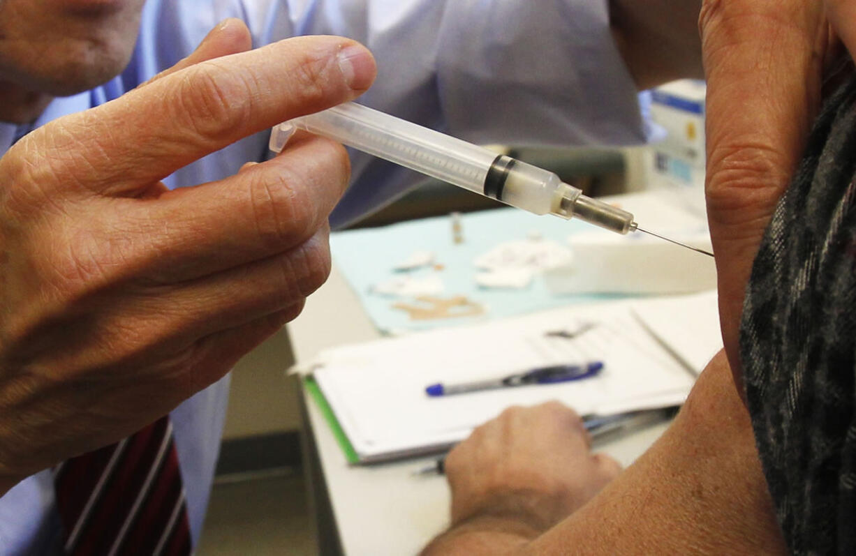 FILE - In this Dec. 19, 2012 file photo, Vermont Health Commissioner Dr. Harry Chen injects a whooping cough vaccine in Barre, Vt. The nation just suffered its worst year for whooping cough in nearly six decades, according to preliminary government figures released Friday, Jan. 4, 2013. Whooping cough ebbs and flows in multi-year cycles, and experts say 2012 appears to have reached a peak with 41,880 cases. Another factor: A vaccine used since the 90s doesn&#039;t last as long as the old one. The vaccine problem may continue to cause higher than normal case counts in the future, said Dr. Tom Clark of the Centers for Disease Control and Prevention.