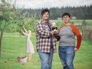 Kelly Keigwin, left, and Sam MacKenzie, with dog Gumdrop, plan to wed at Torque Coffee Roasters Dec. 9, the first day same-sex marriage is legal. Couples can begin applying for marriage licenses Dec. 6.