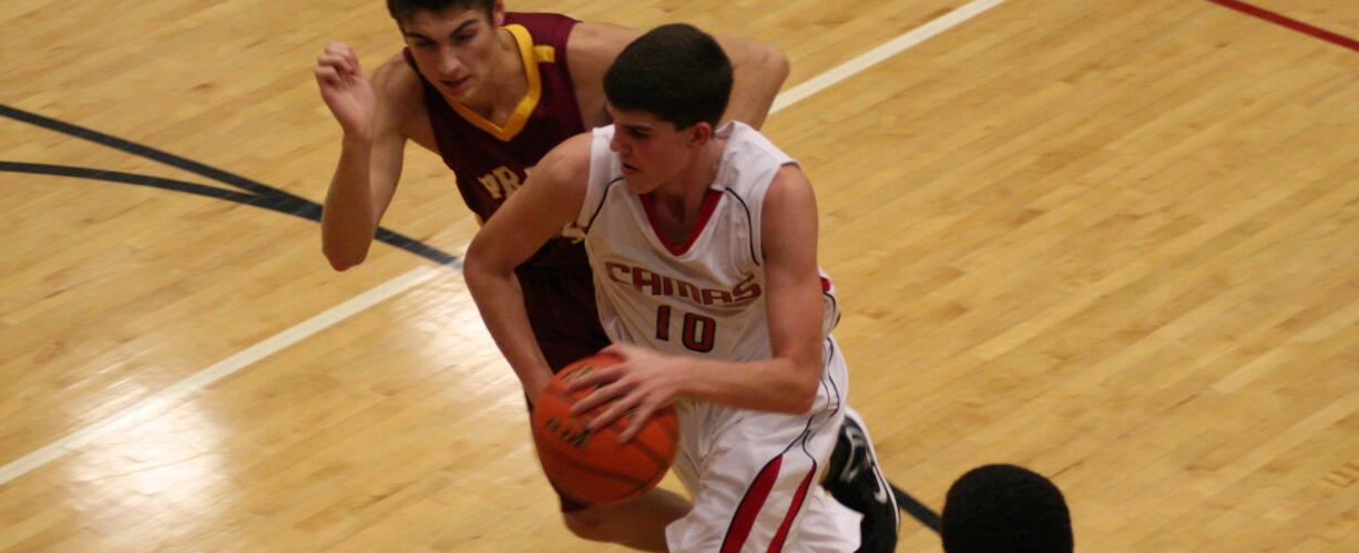 Tyler Hallead drives to the hoop for the Papermakers Friday, at Camas High School.