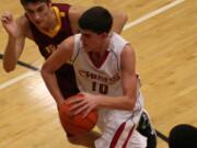 Tyler Hallead drives to the hoop for the Papermakers Friday, at Camas High School.