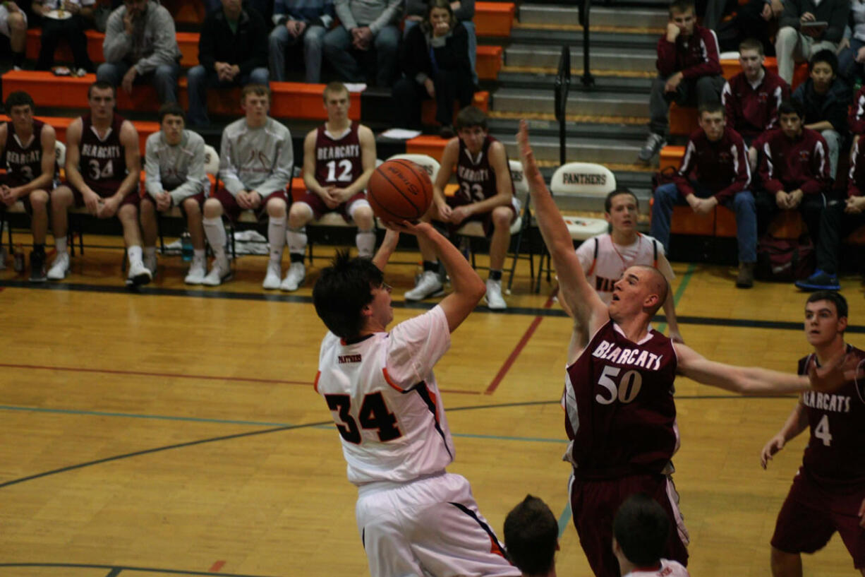 Aaron Deister (left) and the Washougal Panthers are ready to take on all comers on the basketball court. The boys have already played W.F.