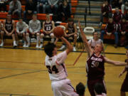 Aaron Deister (left) and the Washougal Panthers are ready to take on all comers on the basketball court. The boys have already played W.F.