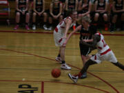 Megan Sharp cuts through two Trappers Thursday, at Fort Vancouver High School.