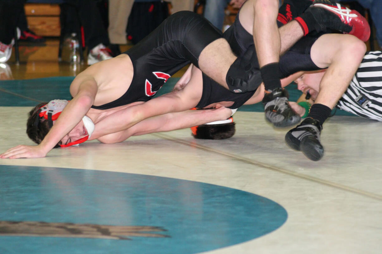 Austin Miller hyperextends his opponent Friday, at La Center High School.