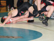 Austin Miller hyperextends his opponent Friday, at La Center High School.