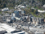 An aerial view of the Georgia-Pacific paper mill in Camas on March 26. &quot;When I graduated from high school, those in my class who hiked down the hill were basically guaranteed a good paying job from Crown Zellerbach,&quot; said former Camas Mayor Nan Henriksen, who helped diversify the city&#039;s economy away from reliance on the mill in the 1980s.