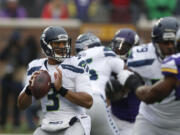 Seattle Seahawks quarterback Russell Wilson (3) looks to throw against the Minnesota Vikings in the first half in Minneapolis. The Seattle Seahawks will play the Baltimore Ravens on Sunday, Dec. 13, 2015.