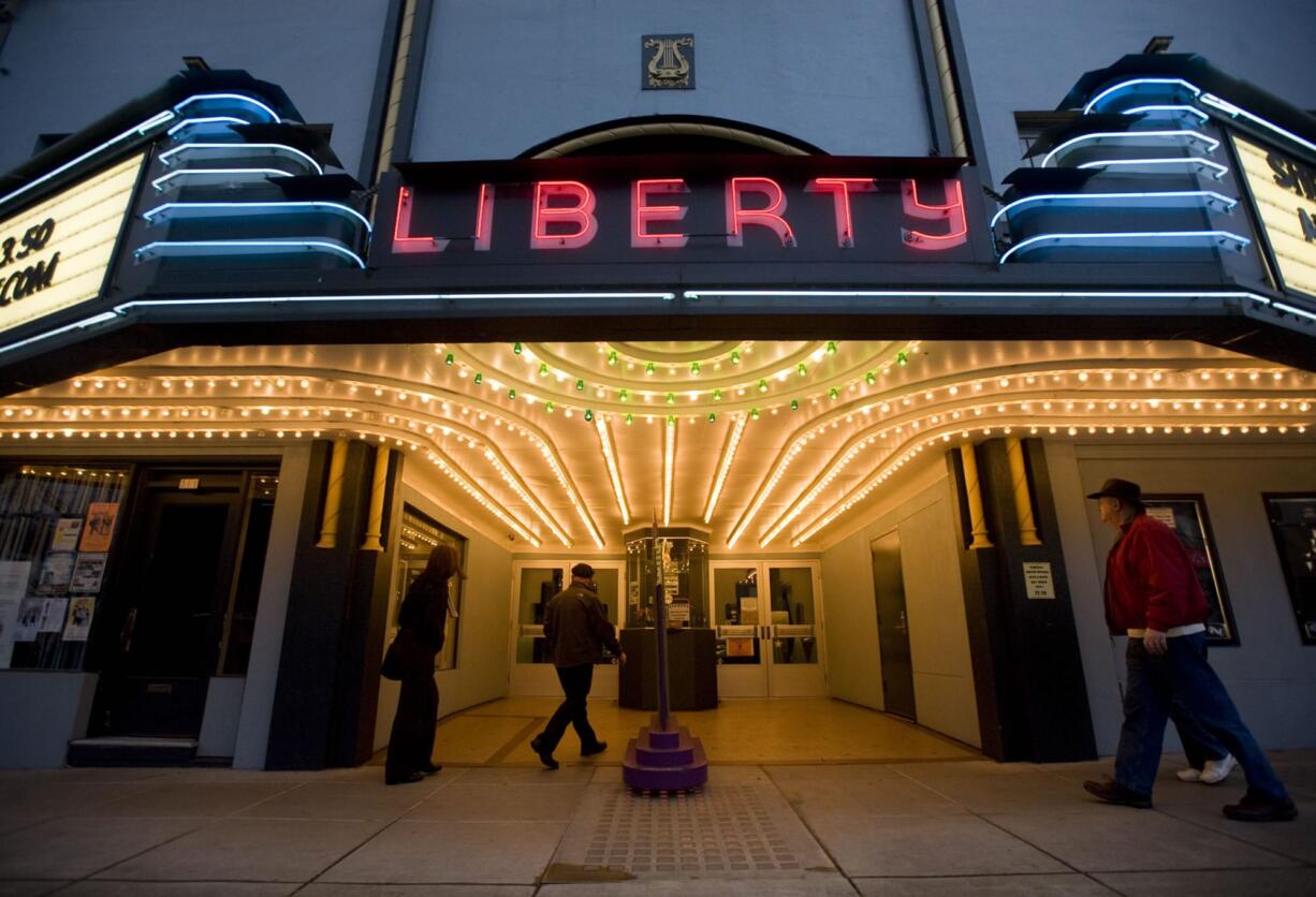 People enter the Camas Liberty Theatre for a movie.