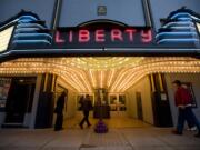 People enter the Camas Liberty Theatre for a movie.