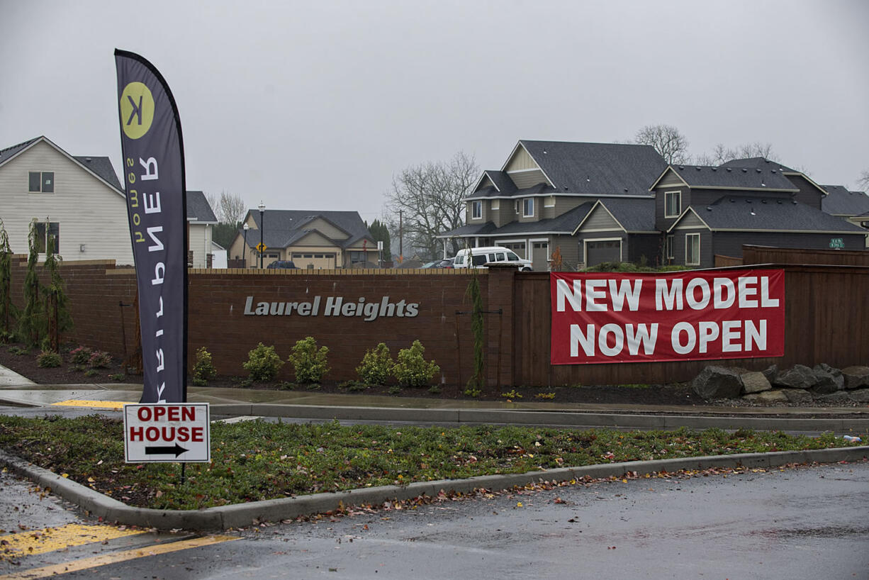 Signs advertise homes for sale in Laurel Heights in Ridgefield.