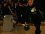 Emily McDonald turns the bowling ball loose Wednesday at Big Al's, while Hunter Lytle, Rebekah Curtis, Katie Hull and Porsche Chartrand cheer her on.