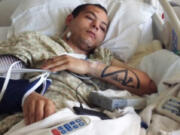 Iraq War veteran Robert Dare is recovering at the VA Medical Center in Vancouver after being struck by a garbage truck in downtown.