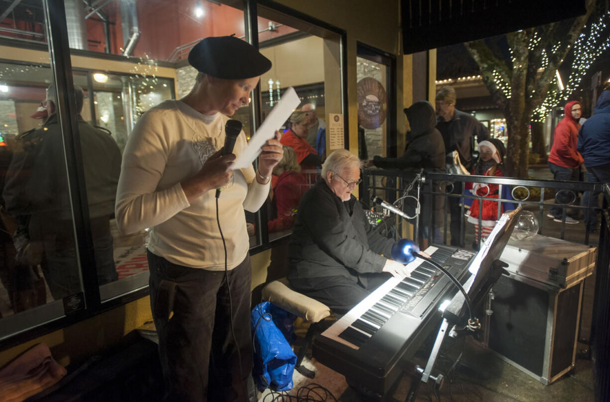 Jodie Gilmore and Dick Kutch sing Christmas songs in downtown Camas at the Hometown Holidays event Dec. 4. The annual celebration draws more than just Camas residents to downtown, as do many of the events that highlight the city&#039;s small-town charm. At top, it was the &quot;Wild Wild West&quot; at a First Saturday parade in downtown Ridgefield this summer.